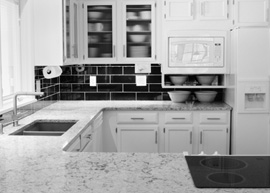 black and white image of kitchen